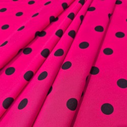 Tela lunares flamencos base fucsia con lunares negros