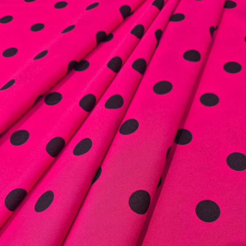 Tela lunares flamencos base fucsia con lunares negros