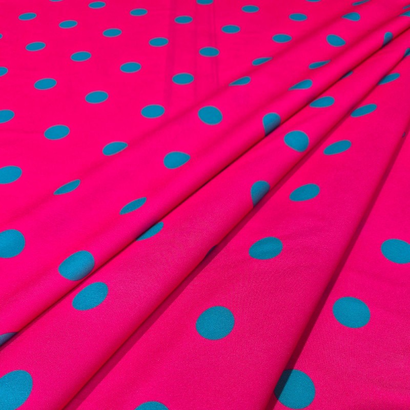 Tela lunares flamencos base fucsia con lunares verde esmeralda